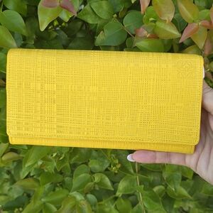 LOEWE WOVEN STYLE  BRIGHT YELLOW LONG WALLET WITH DUST BAG AND BOX.